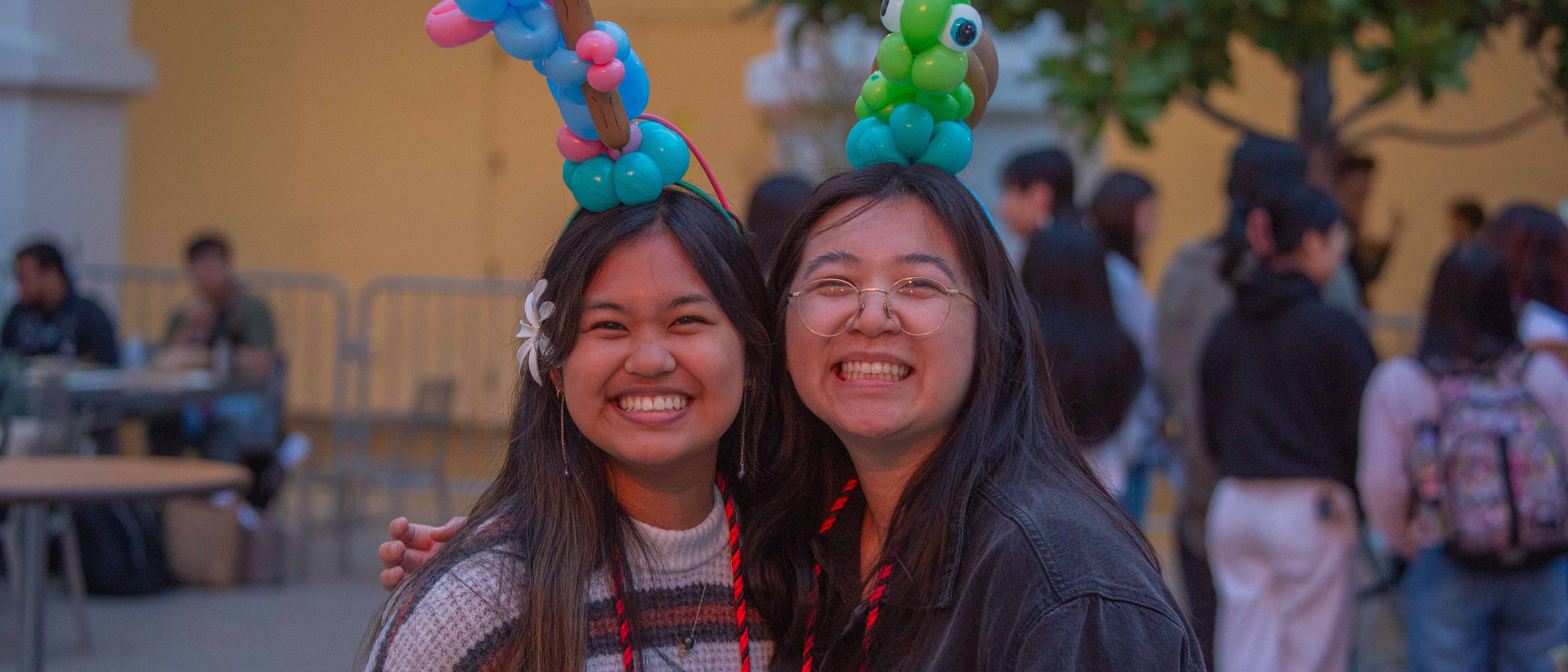 students wearing balloon animal headbands